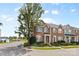 Attractive brick townhome with manicured front yard, offering a welcoming neighborhood atmosphere at 4208 Coulter Xing, Charlotte, NC 28213