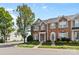 Inviting brick townhome with neat landscaping, featuring classic architectural details at 4208 Coulter Xing, Charlotte, NC 28213