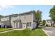 Charming townhouse featuring neutral siding, a well-maintained lawn, and a cozy patio perfect for outdoor relaxation at 4208 Coulter Xing, Charlotte, NC 28213