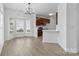 Open-concept kitchen and dining area boasting modern finishes and lots of natural light at 4208 Coulter Xing, Charlotte, NC 28213