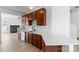 Modern kitchen features stainless steel appliances, quartz counters, and dark wood cabinets at 4208 Coulter Xing, Charlotte, NC 28213