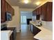 Modern kitchen with stainless steel appliances, light countertops, and wood cabinets at 4208 Coulter Xing, Charlotte, NC 28213