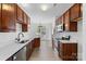 Well-lit kitchen featuring dark cabinets, stainless steel appliances, and bright countertops at 4208 Coulter Xing, Charlotte, NC 28213