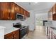 Well-equipped kitchen with stainless appliances, wood cabinets, and ample counter space at 4208 Coulter Xing, Charlotte, NC 28213