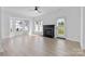 Bright living room featuring a fireplace, lots of windows, and access to the exterior at 4208 Coulter Xing, Charlotte, NC 28213