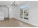 Bright living room featuring wood floors, abundant natural light, and modern chandelier at 4208 Coulter Xing, Charlotte, NC 28213