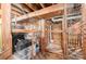 Spacious basement storage area with secure chicken wire enclosure at 4232 Randolph Rd, Charlotte, NC 28211