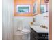 Bathroom with black and white tile floor, natural light and modern fixtures at 4232 Randolph Rd, Charlotte, NC 28211