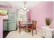Eat-in dining area with vintage refrigerator, retro lighting and modern colors at 4232 Randolph Rd, Charlotte, NC 28211