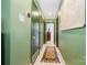 Hallway featuring unique color scheme and vintage rug at 4232 Randolph Rd, Charlotte, NC 28211