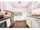Bright kitchen featuring white cabinetry, stainless steel appliances, and granite countertops at 4232 Randolph Rd, Charlotte, NC 28211