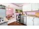 Bright, well-lit kitchen with white cabinets, stainless steel appliances, and a modern design at 4232 Randolph Rd, Charlotte, NC 28211