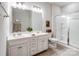 Neutral bathroom with dual vanity, tiled shower and floors at 4310 Coachwhip Ave, Lancaster, SC 29720