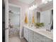 Bright bathroom boasts a dual sink vanity with white cabinetry and stylish decor, offering a clean, modern aesthetic at 4310 Coachwhip Ave, Lancaster, SC 29720
