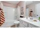 Bright bathroom features a tub-shower, crisp white vanity, modern fixtures, and neutral decor for a relaxing retreat at 4310 Coachwhip Ave, Lancaster, SC 29720