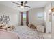 Inviting bedroom with a ceiling fan, charming rug, and ample natural light streaming through the large windows at 4310 Coachwhip Ave, Lancaster, SC 29720