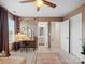 Spacious bedroom features a ceiling fan, a large rug, and a stylish desk setup, complemented by a private bathroom at 4310 Coachwhip Ave, Lancaster, SC 29720