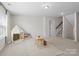 Bright bonus room with neutral carpet, a playful tent, and easy access to the staircase at 4310 Coachwhip Ave, Lancaster, SC 29720