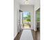 Inviting foyer with hardwood floors, a view to the outdoors, and ample natural light shining through the door at 4310 Coachwhip Ave, Lancaster, SC 29720