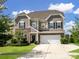 Charming two-story home with a stone and siding exterior, well-manicured lawn, and attached two-car garage at 4310 Coachwhip Ave, Lancaster, SC 29720