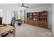 Bright office space featuring a ceiling fan, an organized bookcase, and a comfortable workstation for productivity at 4310 Coachwhip Ave, Lancaster, SC 29720
