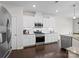 Well-lit kitchen featuring stainless steel appliances, white cabinets and elegant countertops at 4310 Coachwhip Ave, Lancaster, SC 29720