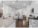 Modern kitchen with stainless steel appliances, granite countertops, white cabinets, and hardwood floors at 4310 Coachwhip Ave, Lancaster, SC 29720