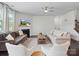 Open living room with comfortable seating, fireplace, ceiling fan, and neutral decor for relaxation at 4310 Coachwhip Ave, Lancaster, SC 29720