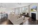Inviting living room with hardwood floors, neutral palette, and cozy seating arrangement near the dining area at 4310 Coachwhip Ave, Lancaster, SC 29720
