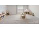 Spacious playroom with carpet, natural light, and reading nook at 4310 Coachwhip Ave, Lancaster, SC 29720