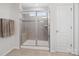 Bathroom tiled shower with glass doors and towel rack at 4310 Coachwhip Ave, Lancaster, SC 29720