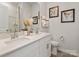 Bathroom featuring double sinks, a vanity with modern fixtures, and decorative accents at 438 Bent Burr Crk, York, SC 29745