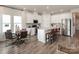 Modern kitchen featuring stainless steel appliances, a large island, and a cozy dining area at 438 Bent Burr Crk, York, SC 29745
