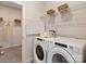 Functional laundry room with modern washer and dryer units and ample storage at 438 Bent Burr Crk, York, SC 29745