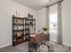 Cozy office space with a modern desk, shelving, and a comfortable chair at 438 Bent Burr Crk, York, SC 29745