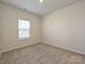 Inviting bedroom features carpet, natural lighting, and neutral colors for a cozy atmosphere at 450 Bent Burr Crk, York, SC 29745