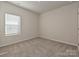 Neutral bedroom with one window with blinds and carpeting at 450 Bent Burr Crk, York, SC 29745
