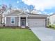 Charming one-story home with a well-manicured lawn and a two-car garage at 450 Bent Burr Crk, York, SC 29745
