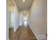 Inviting hallway with wood-look flooring, leading to various rooms in the house at 450 Bent Burr Crk, York, SC 29745