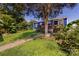 Backyard view of the home with a wooden deck and lush greenery at 455 Wood Ave, Kannapolis, NC 28083