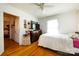 Bedroom with a dresser, TV, and a door leading to another room at 455 Wood Ave, Kannapolis, NC 28083