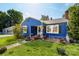 Quaint blue bungalow with black shutters, a well-maintained lawn, and charming curb appeal at 455 Wood Ave, Kannapolis, NC 28083