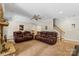 Spacious basement living area with stone fireplace, plush seating, and ample lighting at 4740 Myers Ln, Harrisburg, NC 28075