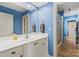 Bathroom with a large mirror, white vanity, and a separate shower room at 4740 Myers Ln, Harrisburg, NC 28075