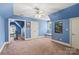 Spacious bedroom featuring blue walls, a ceiling fan, and access to exercise room at 4740 Myers Ln, Harrisburg, NC 28075