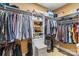 Walk-in closet with ample hanging space and shelving for storage at 4740 Myers Ln, Harrisburg, NC 28075