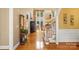Bright foyer features hardwood floors and a staircase leading to the upper level at 4740 Myers Ln, Harrisburg, NC 28075