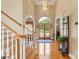 Bright foyer features hardwood floors, a chandelier and a staircase at 4740 Myers Ln, Harrisburg, NC 28075