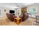 Open living room features a stone fireplace and access to the outdoor area at 4740 Myers Ln, Harrisburg, NC 28075