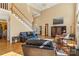 Cozy living room with hardwood floors, staircase, and vaulted ceilings at 4740 Myers Ln, Harrisburg, NC 28075